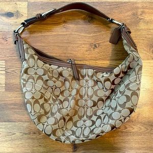 Circular brown Coach Purse